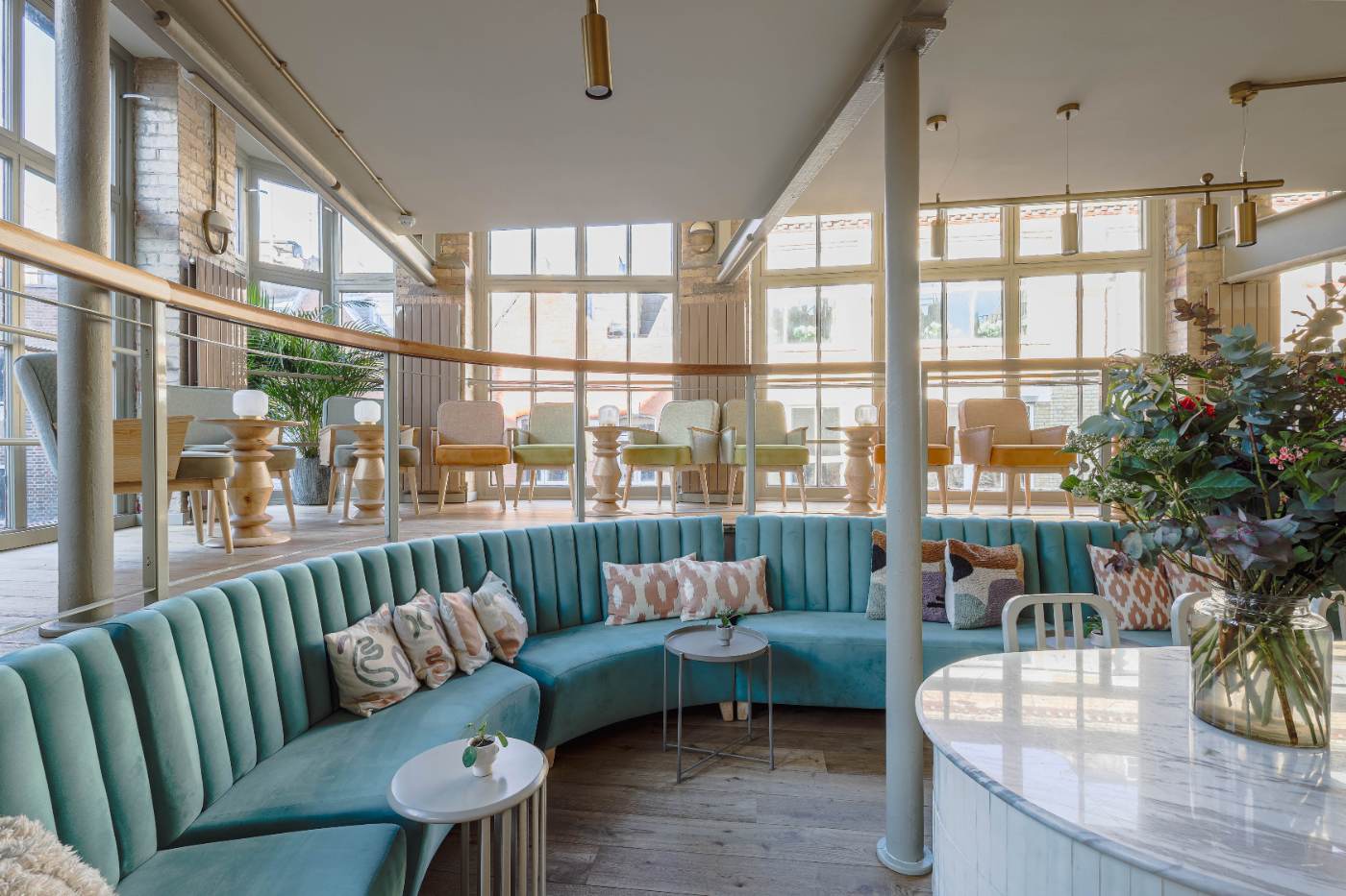 The curved blue banquette in The Loft