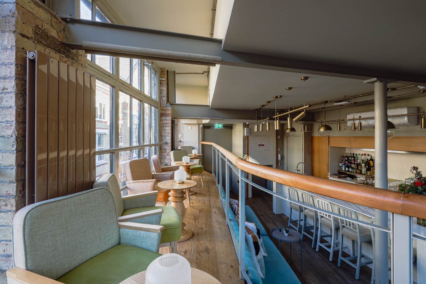 The Loft at Zahter, with blue banquettes and arched windows
